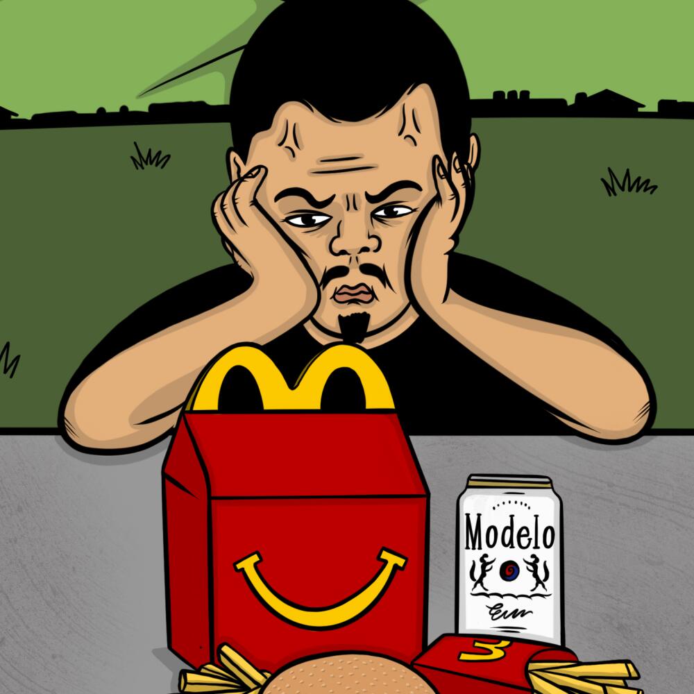 Angry man looking at a mcdonalds happy meal box 