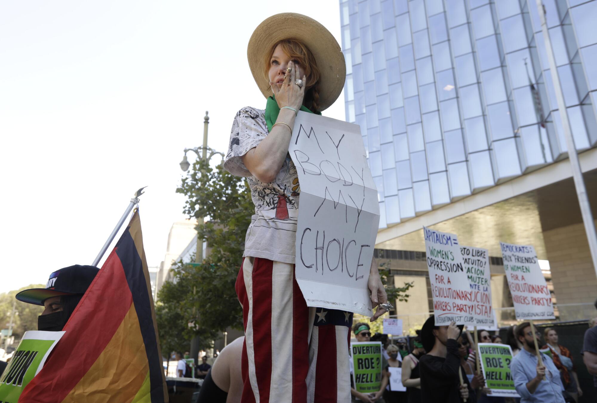 Abortion rights advocate Eleanor Wells, 34, wipes away tears during a protest.