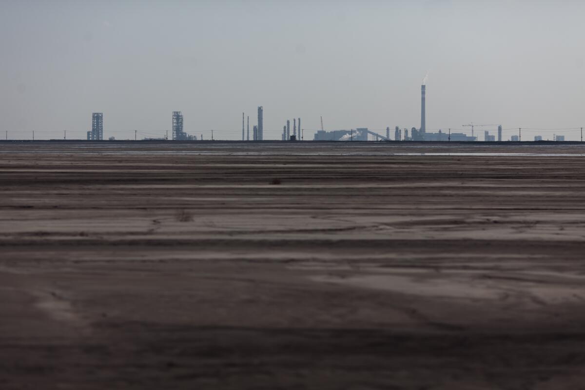 A photo taken on Aug. 19, 2012, shows a general view of a lake surrounded by rare-earth refineries near the Inner Mongolian city of Baotou. On the edge of the city, a lake is blackened by pollution from factories processing rare earths.