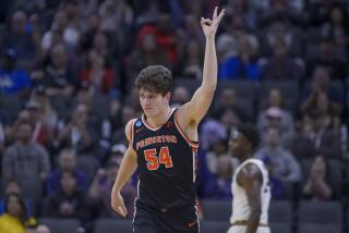 Princeton forward Zach Martini reacts after sinking a three-pointer against Missouri on March 18, 2023.