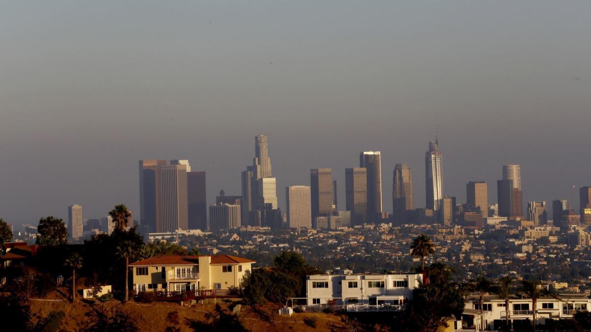 The downtown Los Angeles skyline is seen from near the Griffith Park Observatory on Aug. 10, 2016.
