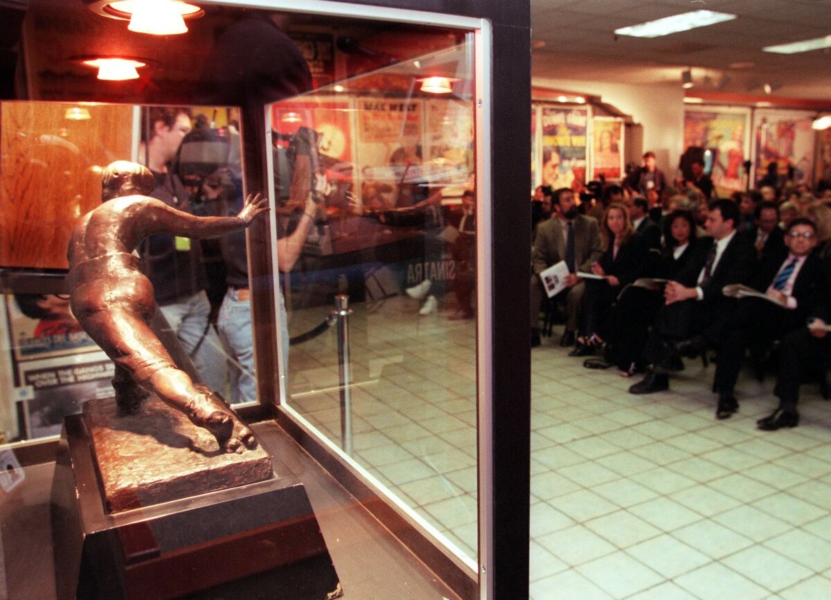 O.J. Simpson's personal Heisman Trophy, seen in 1999, was the centerpiece at a court-ordered auction at Butterfield and Butterfield that year. USC's trophy was stolen in 1994.