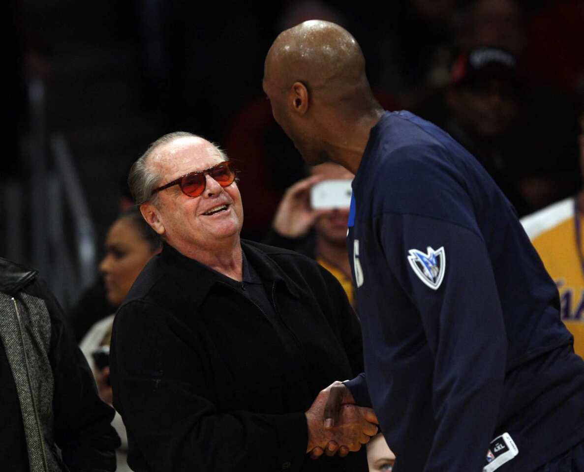 Mavericks forward Lamar Odom is greeted by longtime Lakers fan Jack Nicholson duirng his first game back at Staples Center.