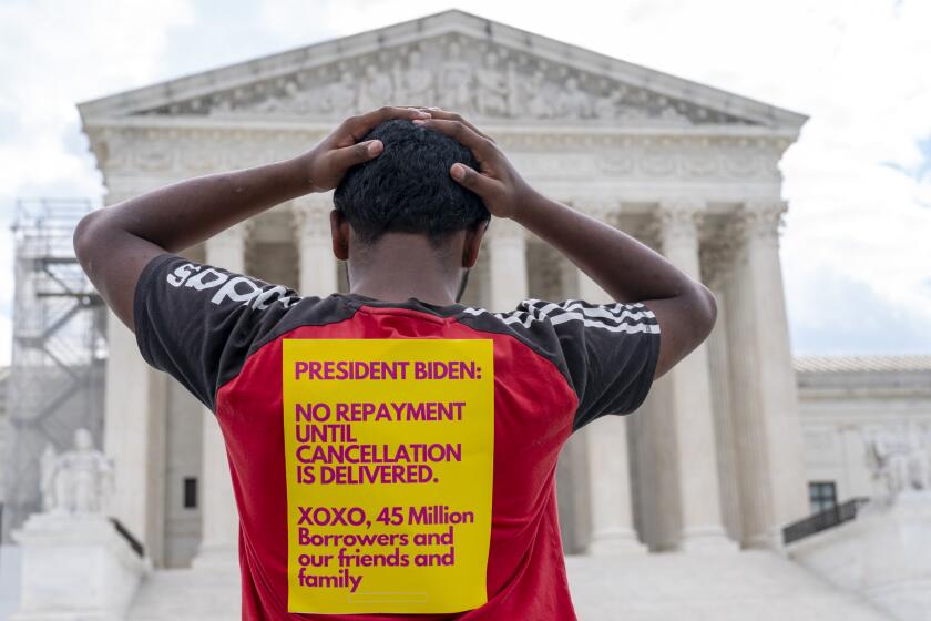 Sourish Dey, an incoming freshman at the University of Maryland who said student debt was a factor in his college application process, protests in favor of student debt cancellation outside of the Supreme Court, Tuesday, June 27, 2023, in Washington. (AP Photo/Jacquelyn Martin)
