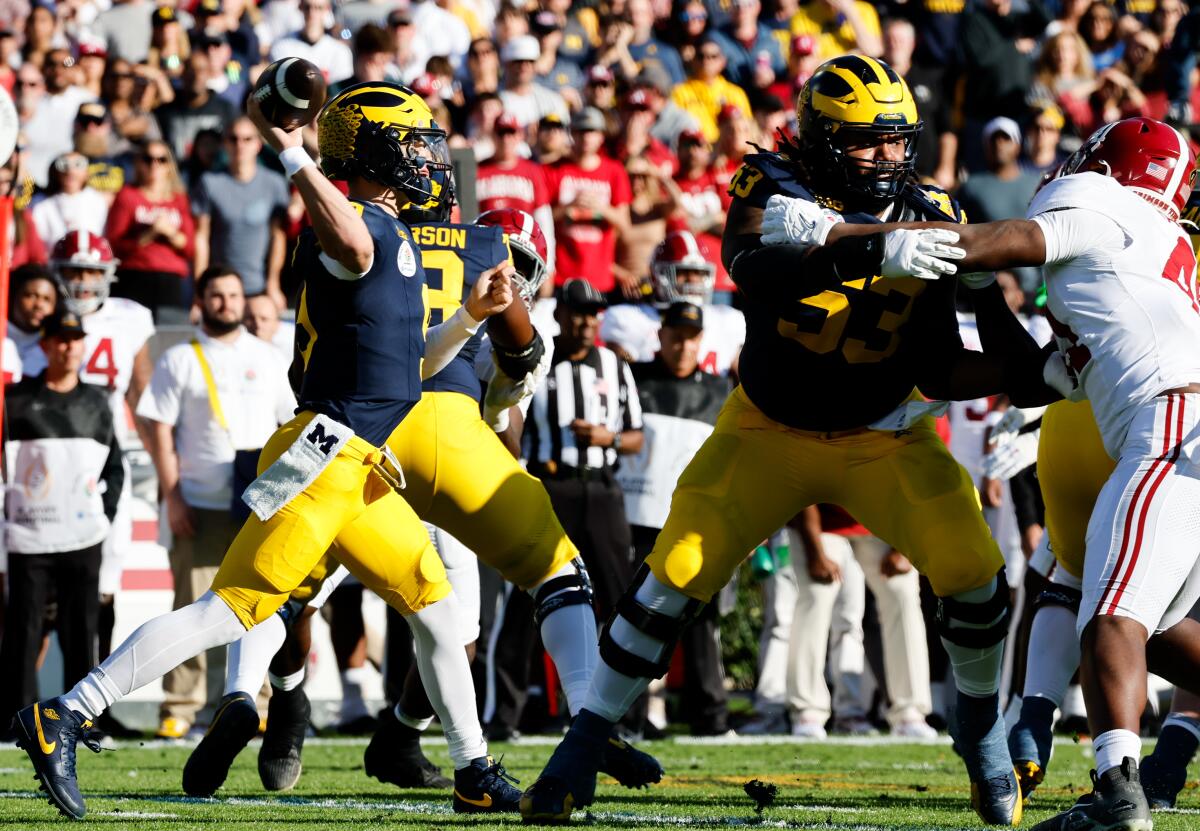 Michigan quarterback J.J. McCarthy passes in the first half of the Wolverines' win over Alabama.