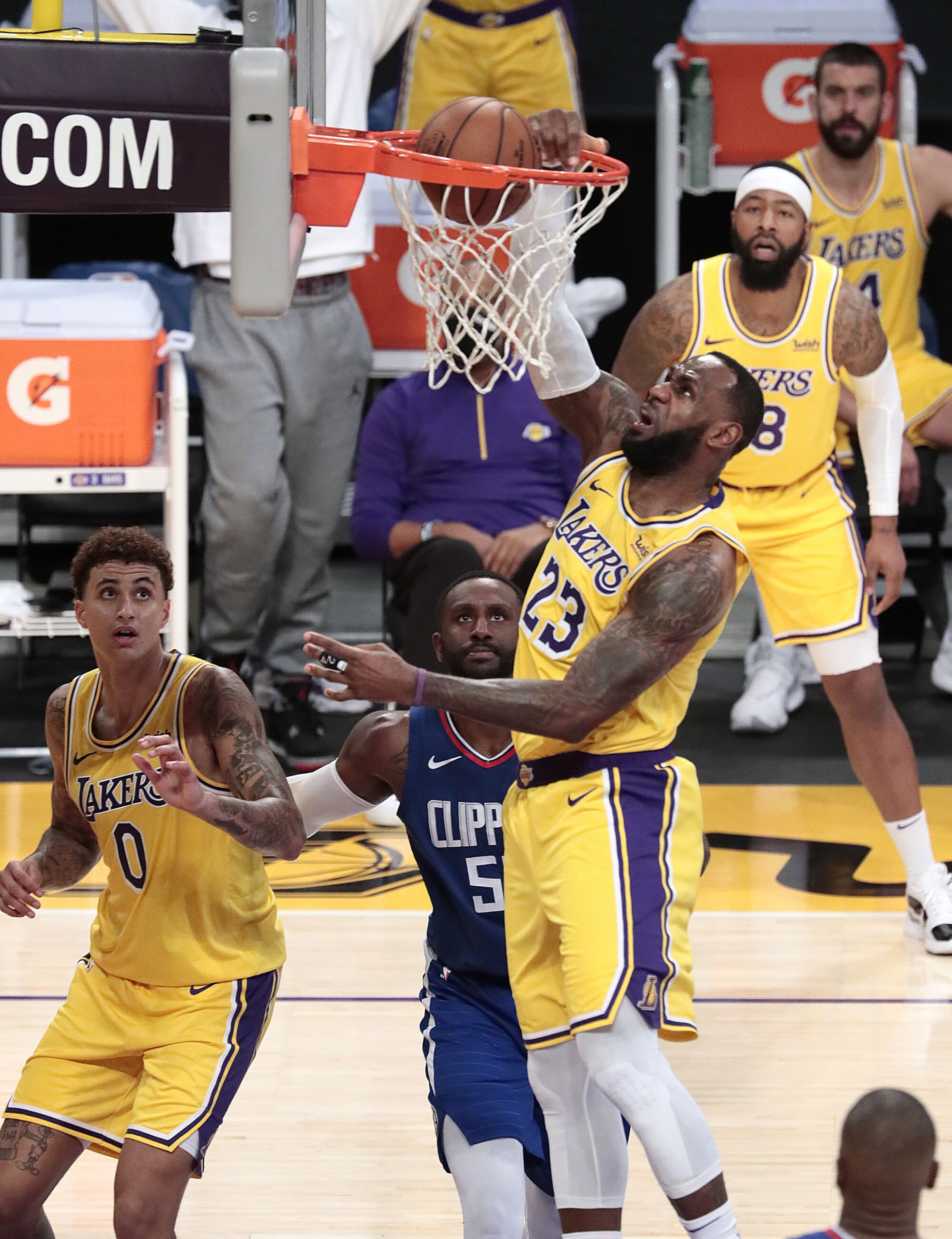 Lakers forward LeBron James drives down the lane for a dunk in the first half.