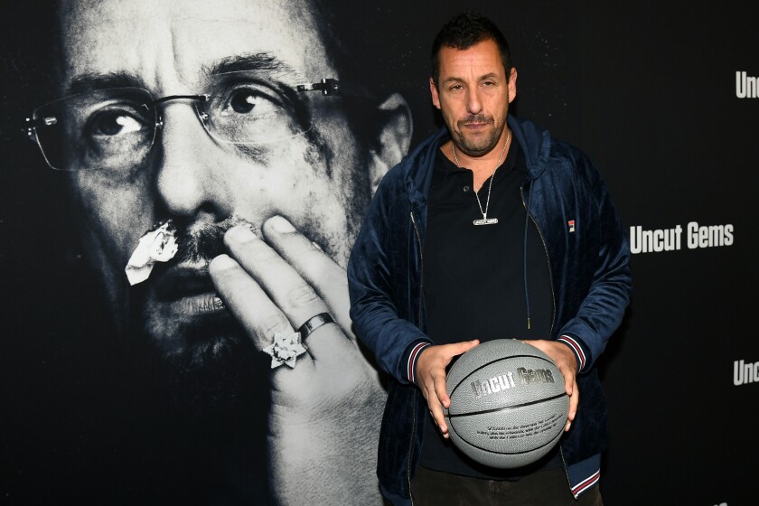 Adam Sandler appears at the premiere of "Uncut Gems" at the Dome at Arclight Hollywood.