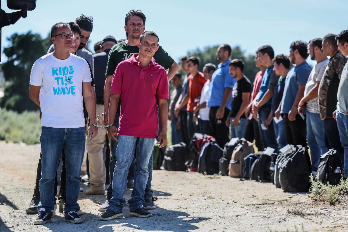 Men seeking asylum are detained by Border Patrol.
