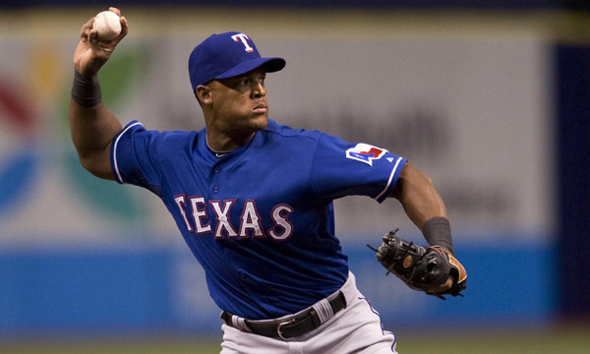 Texas Rangers third baseman Adrian Beltre makes a throw during a game against the Tampa Bay Rays on April 5. The Rangers placed Beltre on the disabled list Sunday.