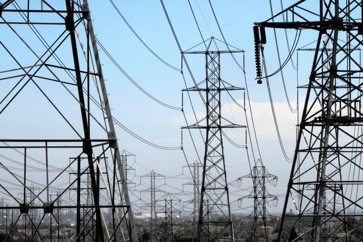 Power lines weave through Redondo Beach. The possible integration of the California Independent System Operator with PacifiCorp could make solar and wind energy more available throughout the West.