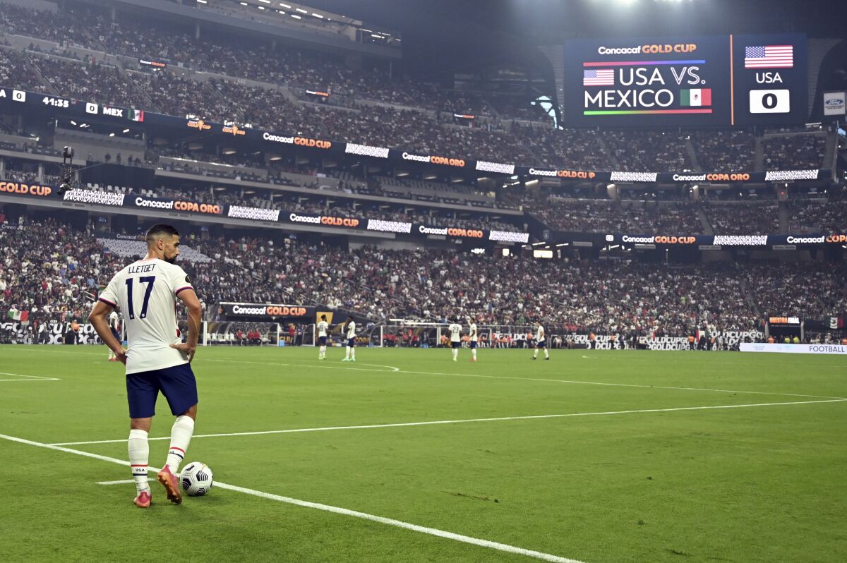United States midfielder Sebastian Lletget waits for play to resume before taking a corner kick against Mexico
