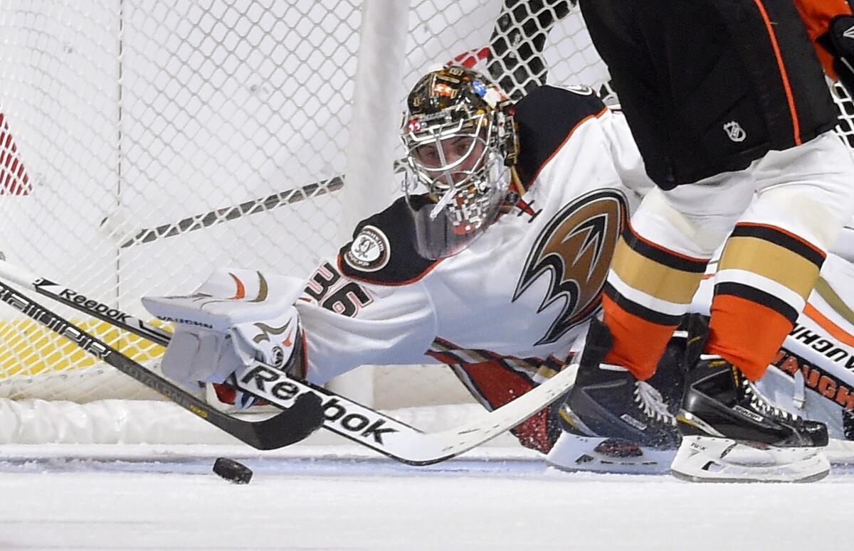 Ducks goalie John Gibson stops a shot during the first period of a preseason game against the Kings on Sept. 25.