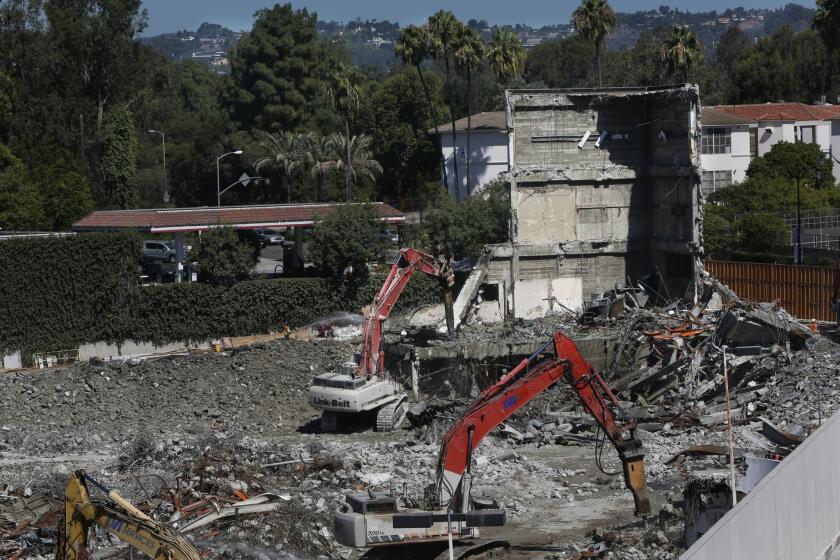 Bulldozers finish tearing down the Robinsons-May store on Wilshire Boulevard on July 23.
