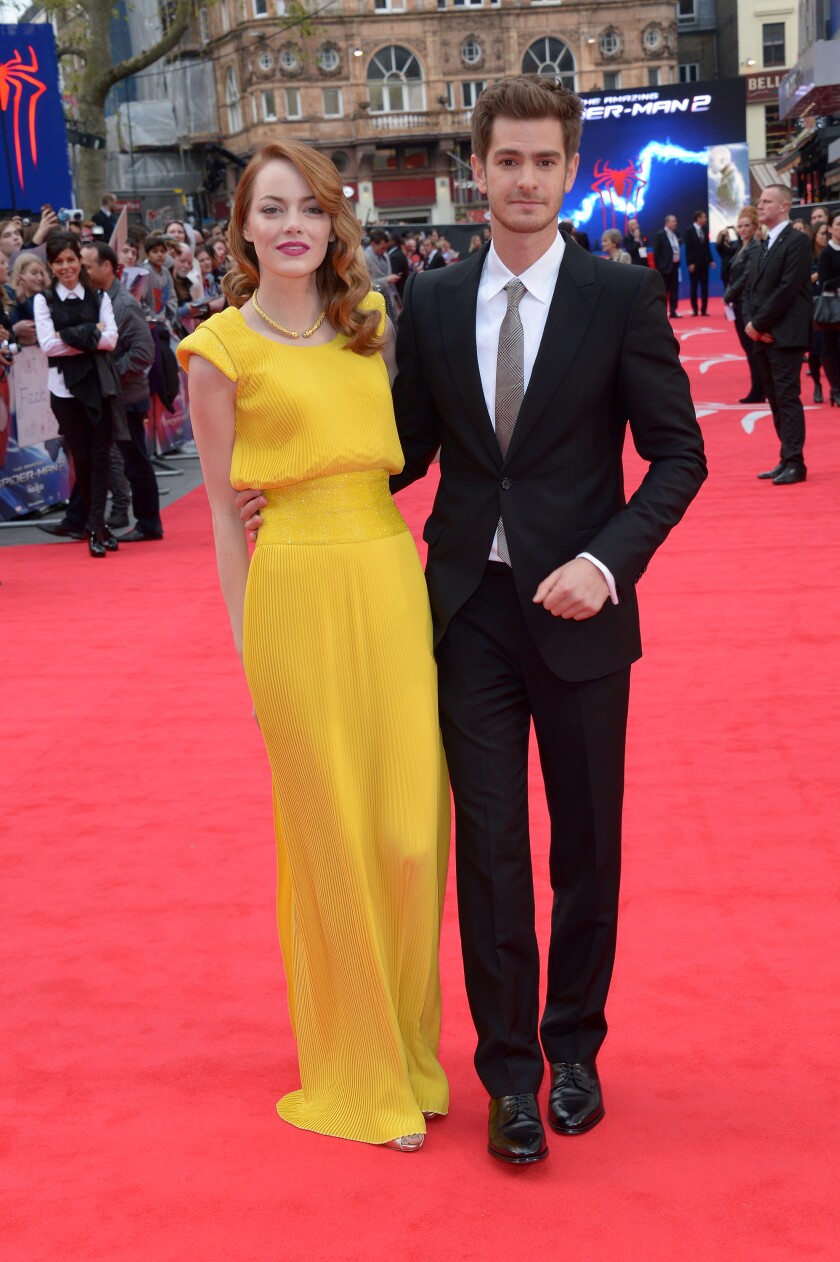 A man and woman arrive at a movie premiere