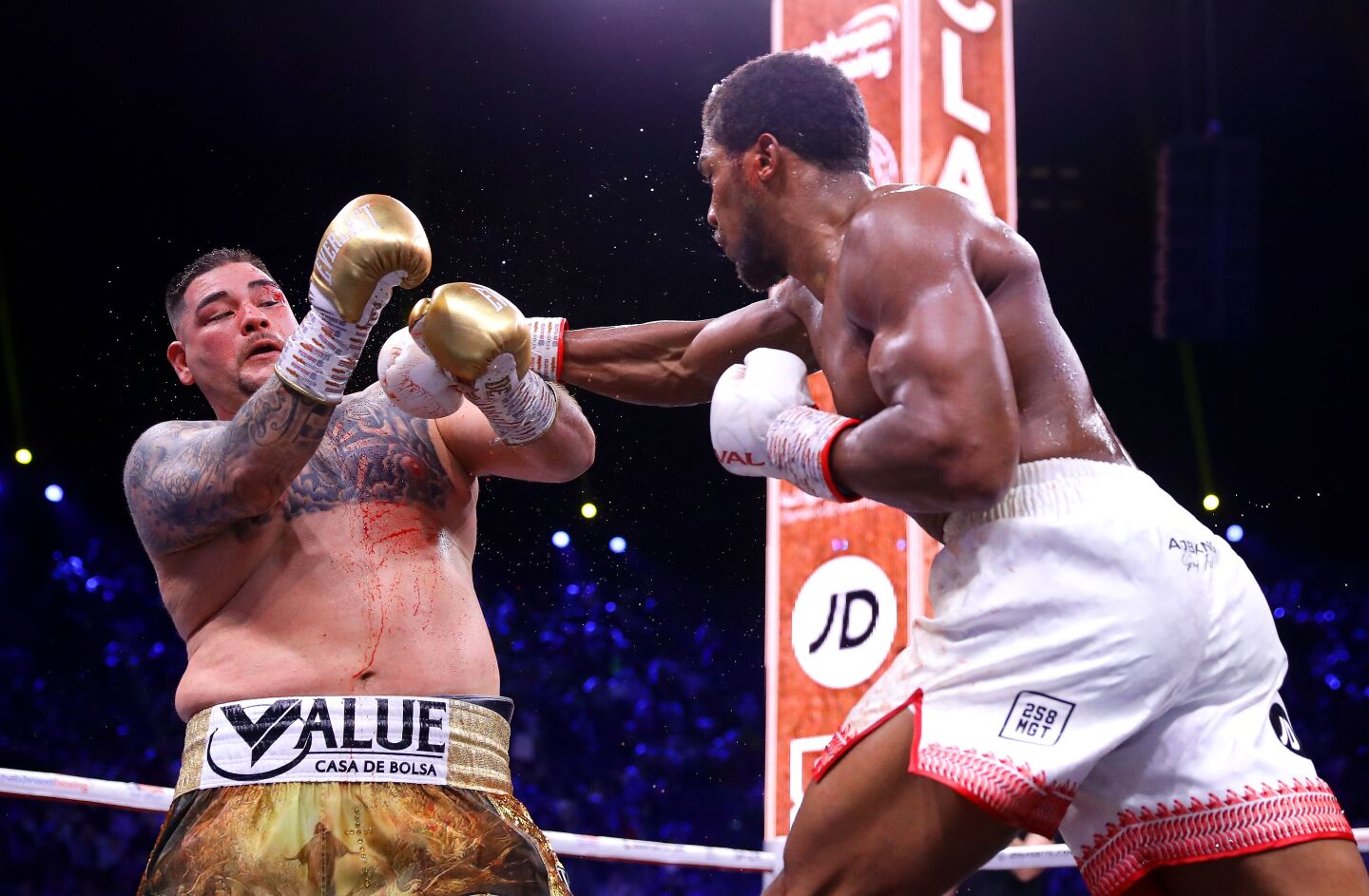 Anthony Joshua hits Andy Ruiz Jr. with a right hand during a heavyweight title fight on Dec. 7 in Diriyah, Saudi Arabia.