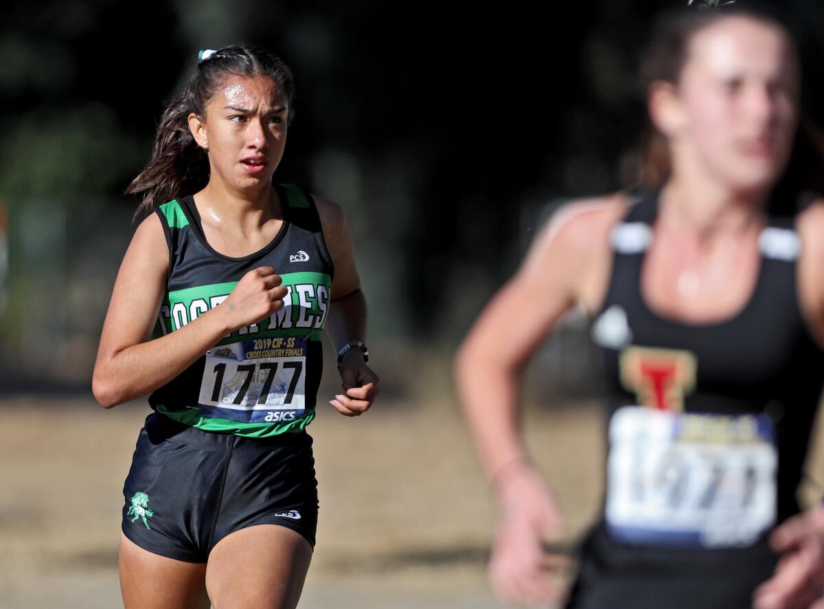 Costa Mesa senior Diane Molina finished fourth in the girls' Division 4 race of the CIF Southern Section cross-country finals at the Riverside City Cross-Country Course on Saturday.