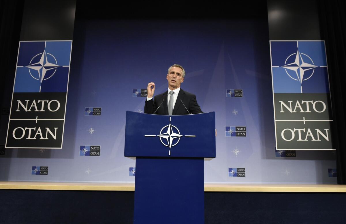 NATO Secretary-General Jens Stoltenberg speaks at a joint news conference during a defense minister meeting at NATO headquarters in Brussels.