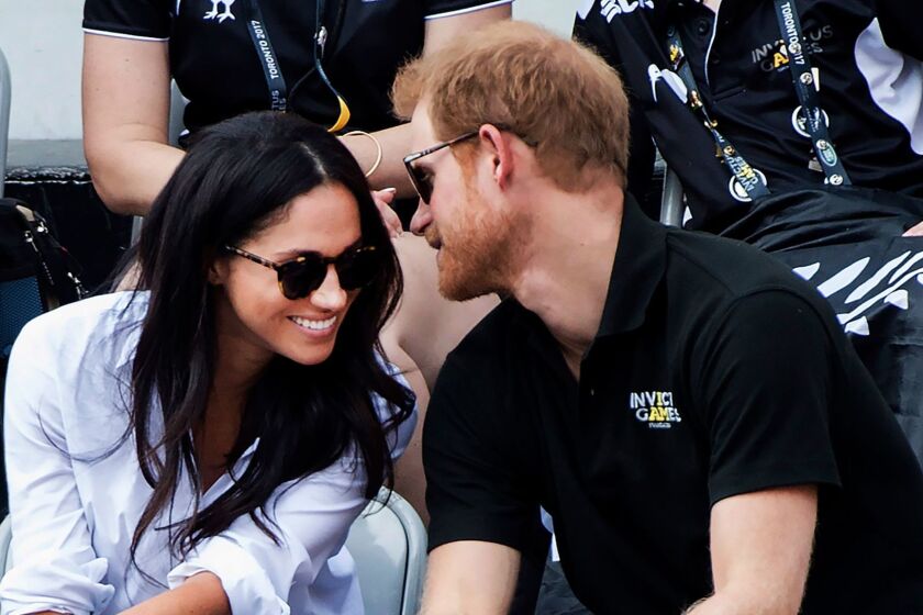 Prince Harry and his girlfriend Meghan Markle attend the wheelchair tennis competition at the Invictus Games in Toronto on Monday, Sept. 25, 2017. (Nathan Denette/The Canadian Press via AP)