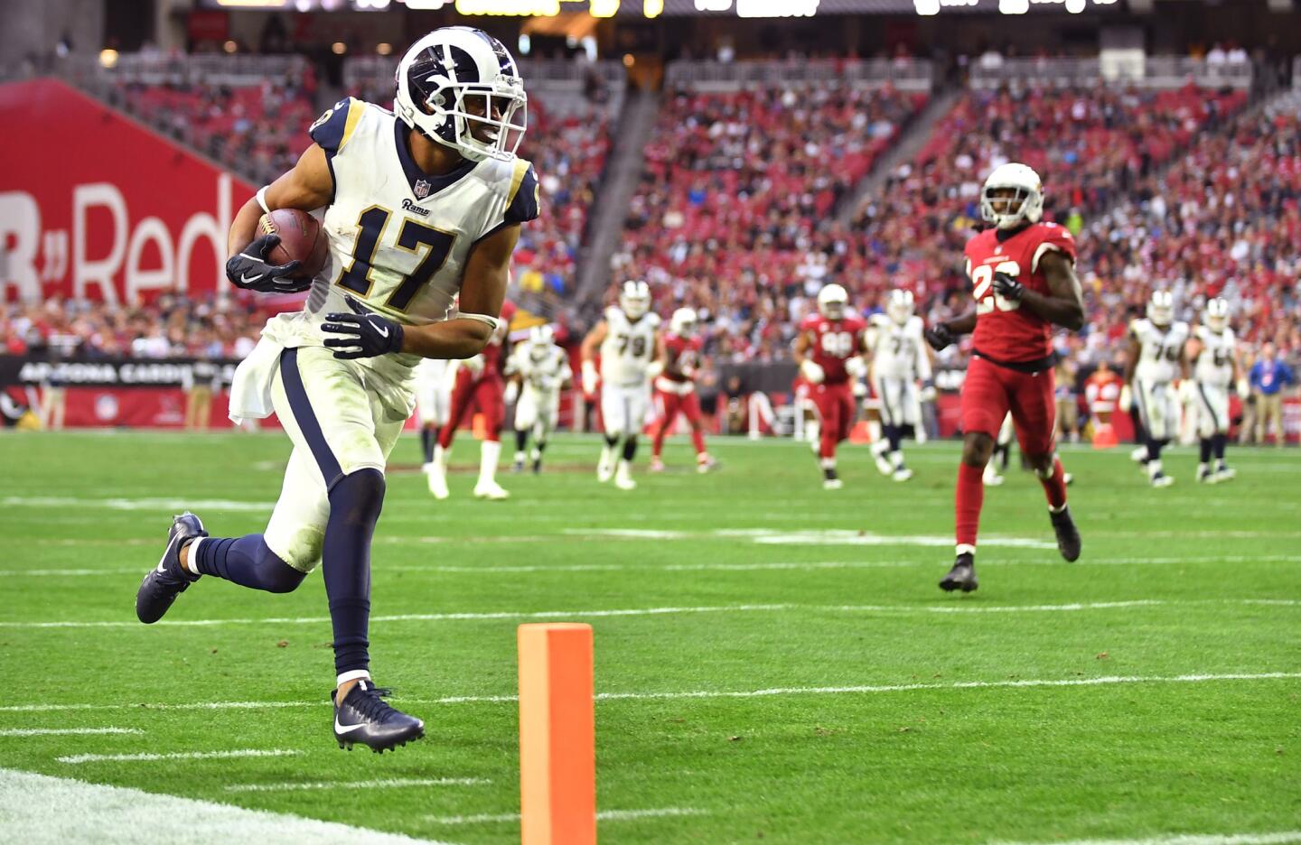 Rams receiver Robert Woods beats the Arizona Cardinals defense to the end zone for a touchdown in the fourth quarter at State Farm Stadium on Sunday.