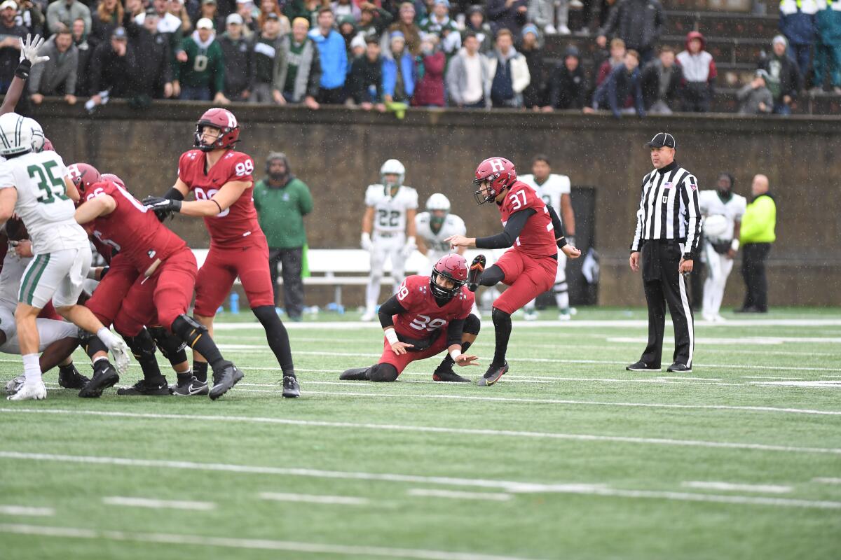 Former Chaminade High kicker Jonah Lipel attempts a field goal for Harvard.