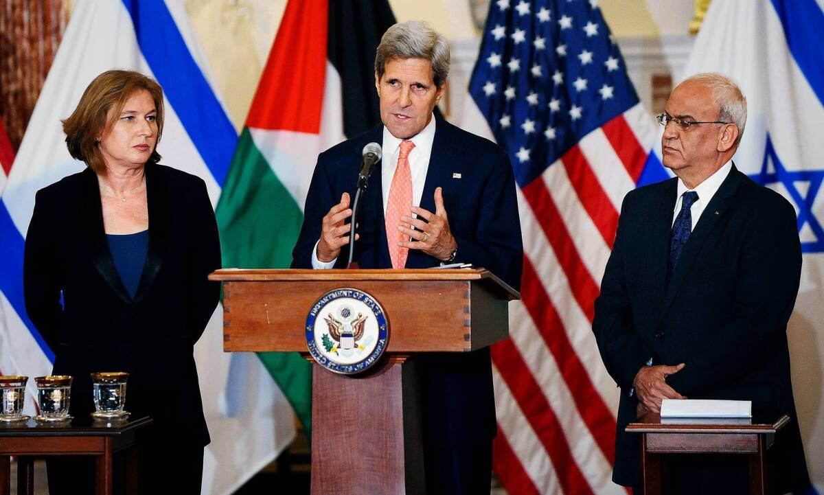 Secretary of State John Kerry delivers remarks as Israeli Justice Minister Tzipi Livni (left) and Palestinian chief negotiator Saeb Erekat (right) listen during a news conference in Washington this week.
