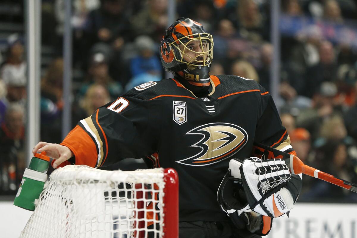 Ducks goalie Ryan Miller looks up during a break in the second period against the Washington Capitals at Honda Center on Feb. 17.