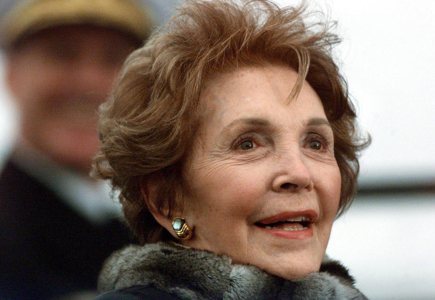 Nancy Reagan listens to speeches at the christening ceremony of the aircraft carrier USS Ronald Reagan at Newport News Shipbuilding Yard in Newport News, Va., in 2001.
