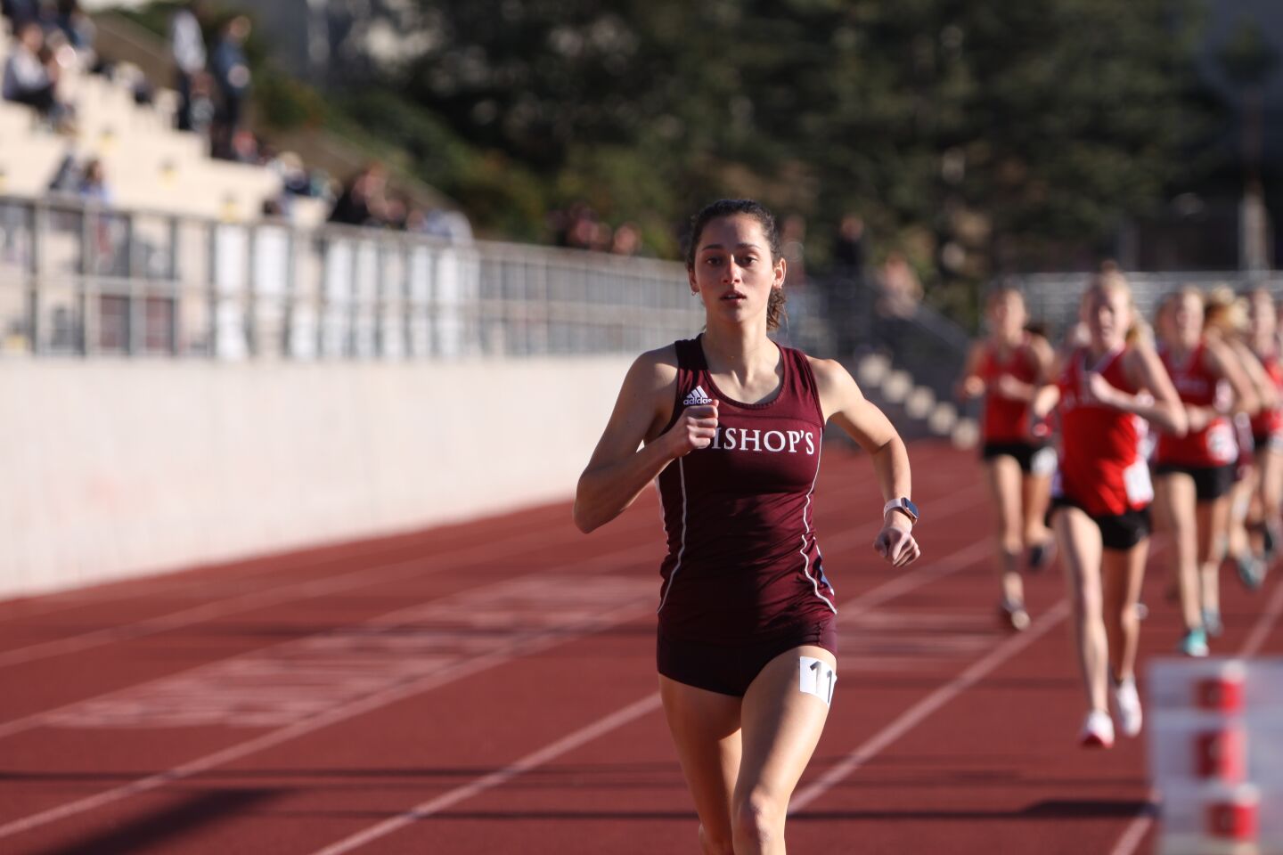 Bishop's School runner Maddie Cramer maintains a big lead in the 1,600-meter race.