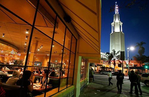 A recent burst of construction activity promises to generate some momentum in efforts to revive Westwood Village as the hippest place to be in L.A. on a Saturday night. Among longtime draws is the venerable Mann Village Theatre, at right, near this popular eatery at Broxton and Weyburn avenues.