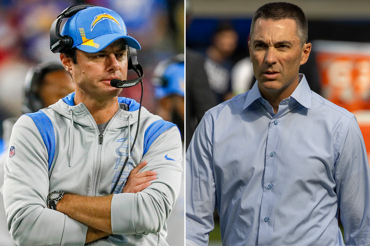 Chargers coach Brandon Staley (left) and general manager Tom Telesco each standing on a sideline.