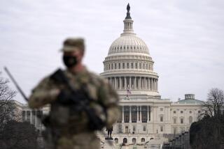 FILE - A member of the National Guard patrols the area outside of the U.S. Capitol at the Capitol in Washington, Wednesday, Feb. 10, 2021. The House passed a defense policy bill Thursday, Dec. 14, 2023, that authorizes the biggest pay raise for troops in more than two decades, overcoming objections from some conservatives concerned the measure did not do enough to restrict the Pentagon's diversity initiatives, abortion travel policy and gender-affirming health care for transgender service members. (AP Photo/Jose Luis Magana, File)