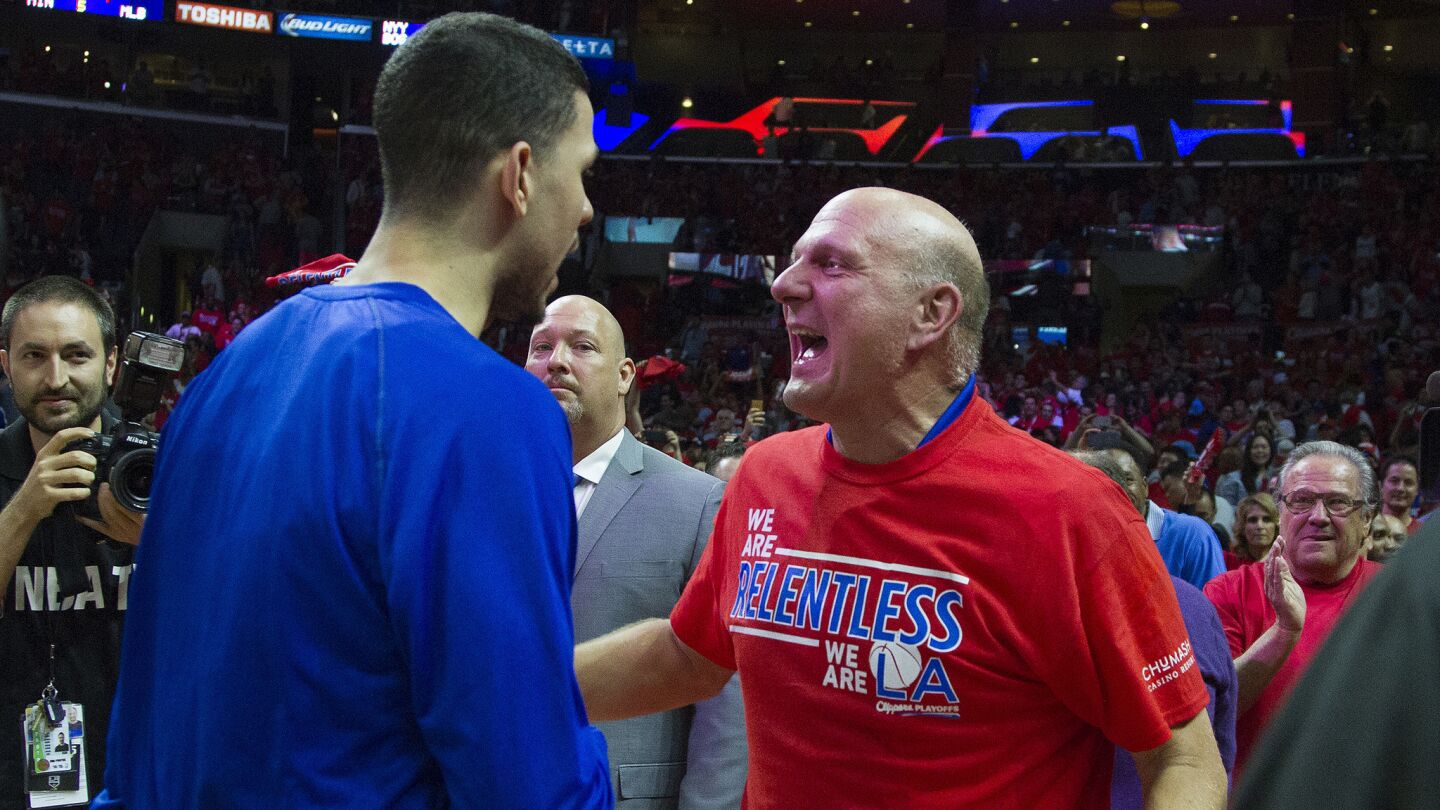 Clippers guard Austin Rivers, left, is congratulated by team owner Steve Ballmer following the team's 111-109 victory over the San Antonio Spurs in Game 7 of the Western Conference quarterfinals at Staples Center on May 2, 2015.