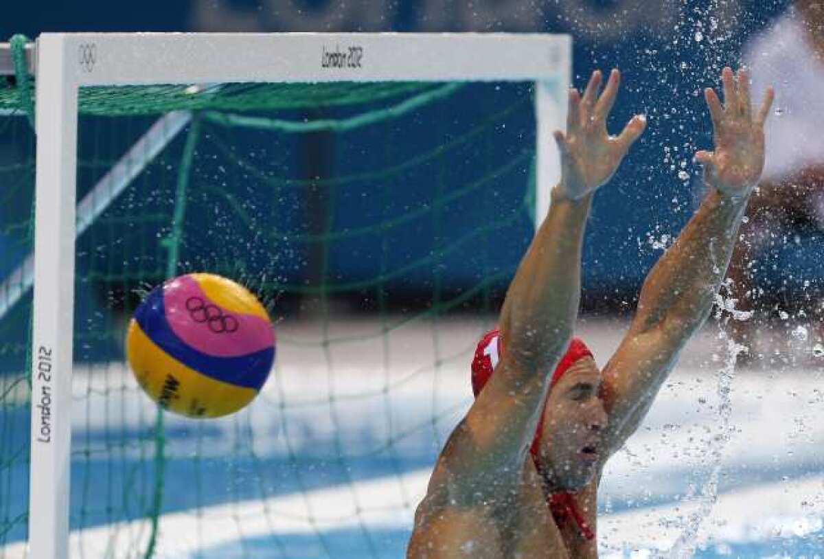 U.S. goalkeeper Merrill Moses can't stop this shot by Hungary's Marton Szivos.