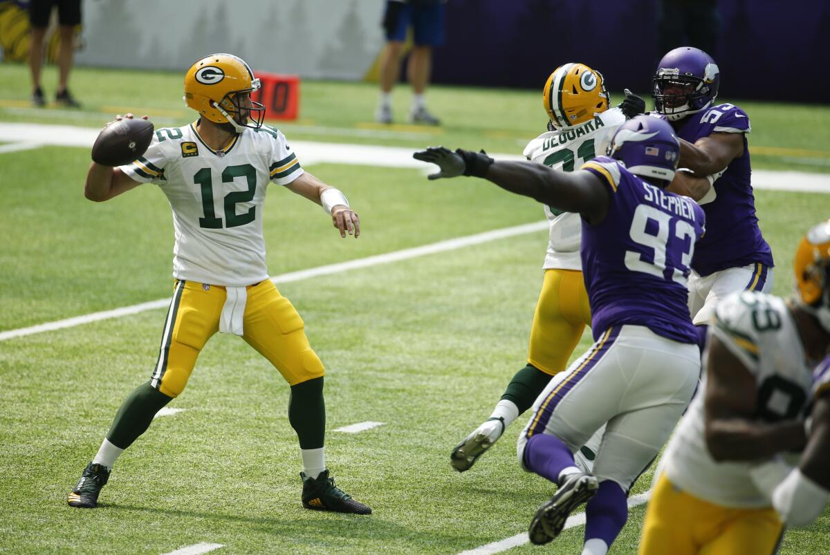 Green Bay Packers quarterback Aaron Rodgers throws against the Minnesota Vikings on Sunday.