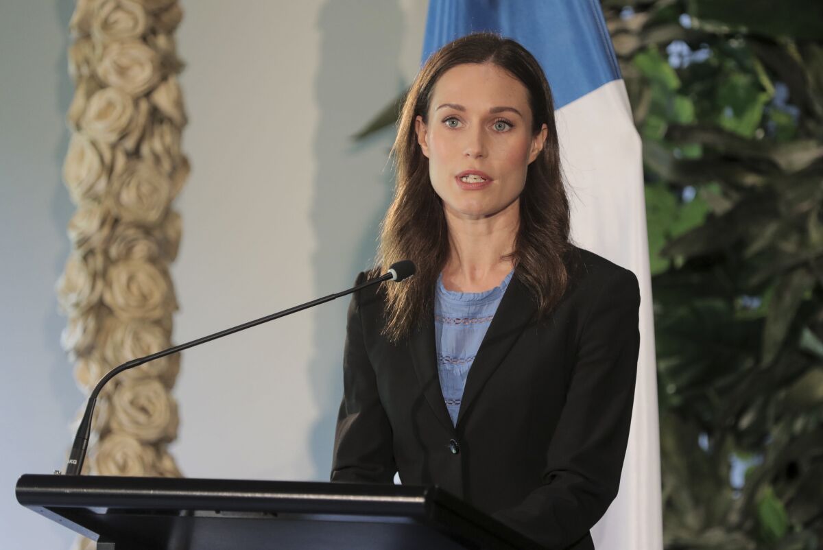 Finland's Prime Minister Sanna Marin addresses a press conference at the Auckland Museum, in Auckland, New Zealand, Wednesday, Nov. 30, 2022. Marin says it must give more weapons and support to Ukraine to ensure it wins its war against Russia. (Michael Craig/New Zealand Herald via AP)
