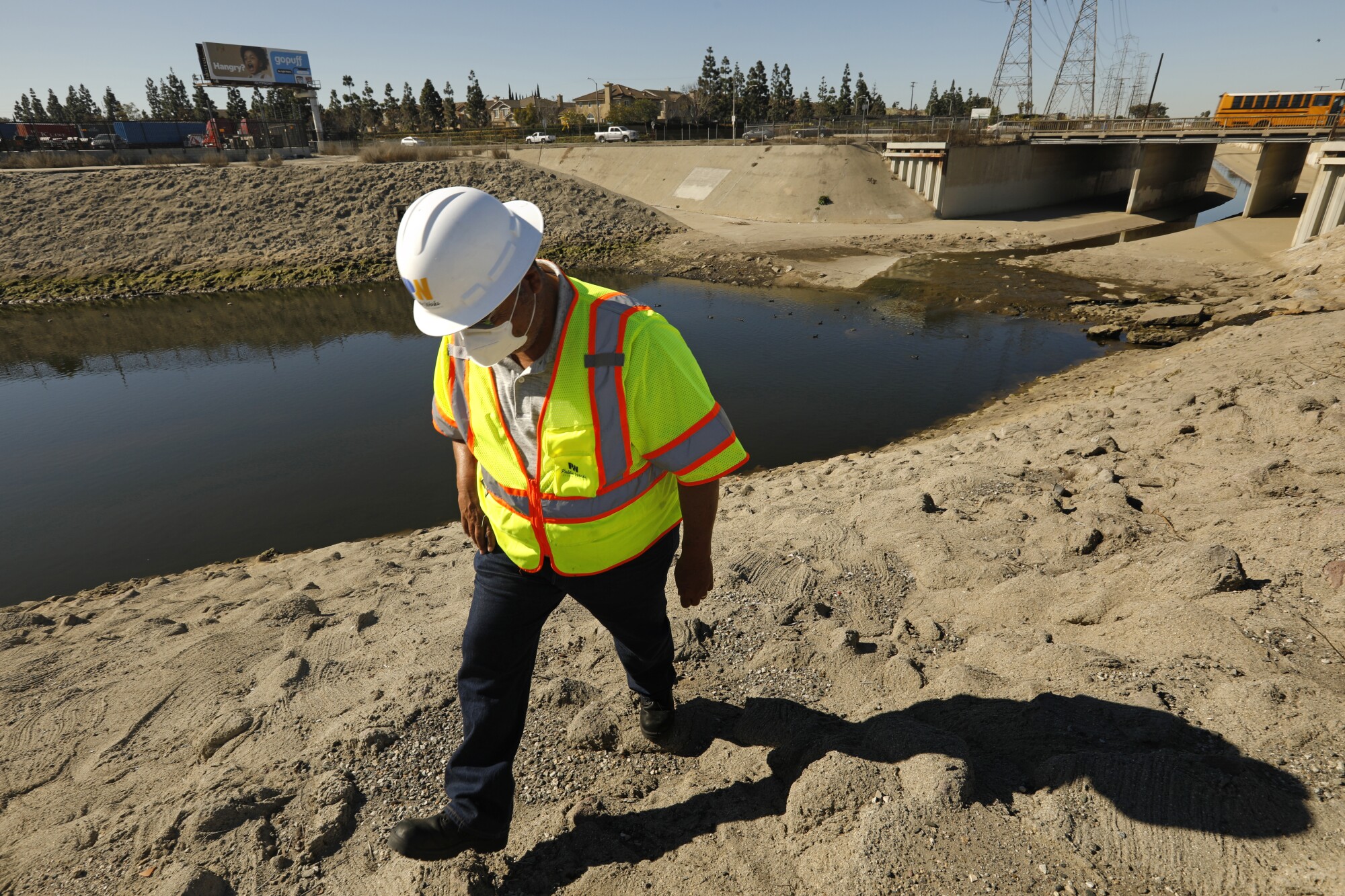 Los Angeles Public Works employee Greg Sarpy walks near the starting point of the Dominguez Channel.