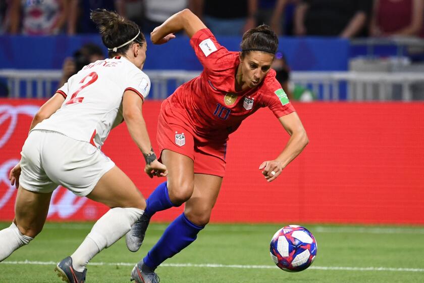 United States' forward Carli Lloyd (R) vies for the ball with England's defender Lucy Bronze during the France 2019 Women's World Cup semi-final football match between England and USA, on July 2, 2019, at the Lyon Satdium in Decines-Charpieu, central-eastern France. (Photo by FRANCK FIFE / AFP) (Photo credit should read FRANCK FIFE/AFP via Getty Images)