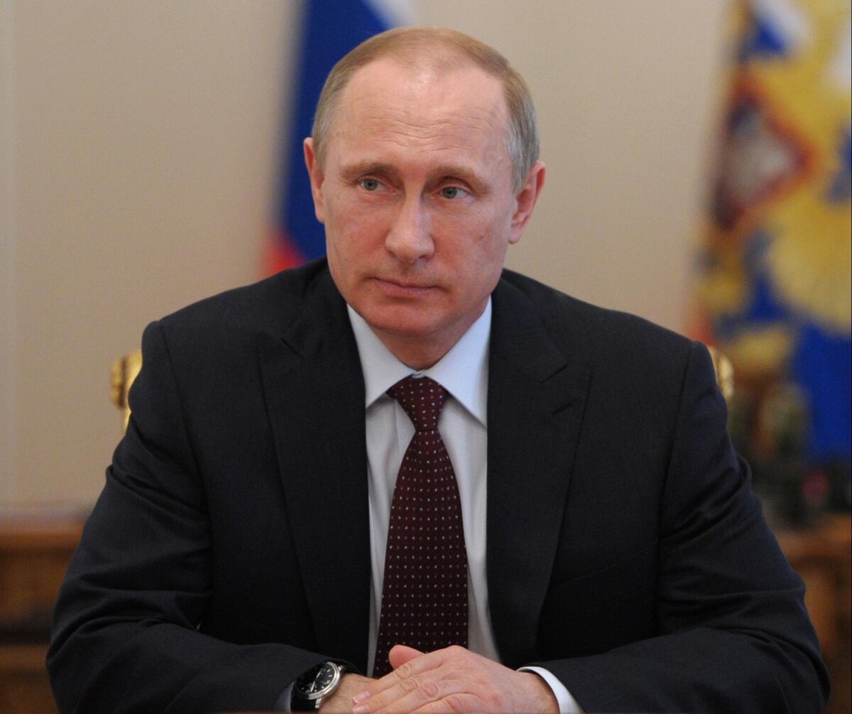 Russian President Vladimir Putin chairs a Security Council meeting in the Novo-Ogaryovo residence outside Moscow.