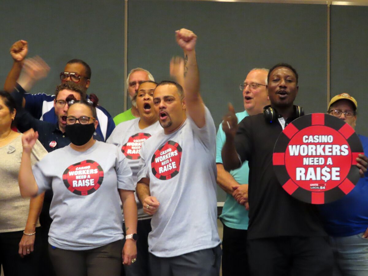 Members of Local 54 of the Unite Here union celebrate after voting on Wednesday, June 15, 2022, in Atlantic City, N.J., to authorize a strike against the casinos next month if a new contract is not reached in two weeks.(AP Photo/Wayne Parry)