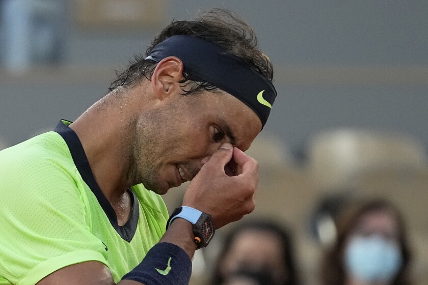 Spain's Rafael Nadal reacts as he plays Serbia's Novak Djokovic rduring their semifinal match of the French Open tennis tournament at the Roland Garros stadium Friday, June 11, 2021 in Paris. (AP Photo/Michel Euler)