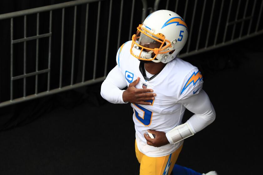 Chargers quarterback Tyrod Taylor runs onto the field before a game against the Cincinnati Bengals on Sept. 13.