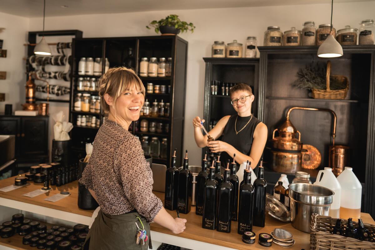 A woman and shopper in a botanical skin care store