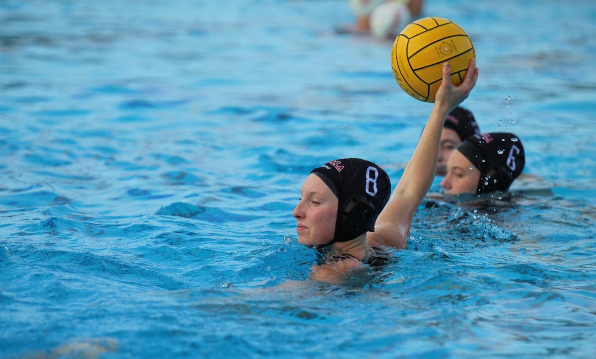La Jolla High School senior Jenna Drobeck (8) is pictured in action on the water polo team.