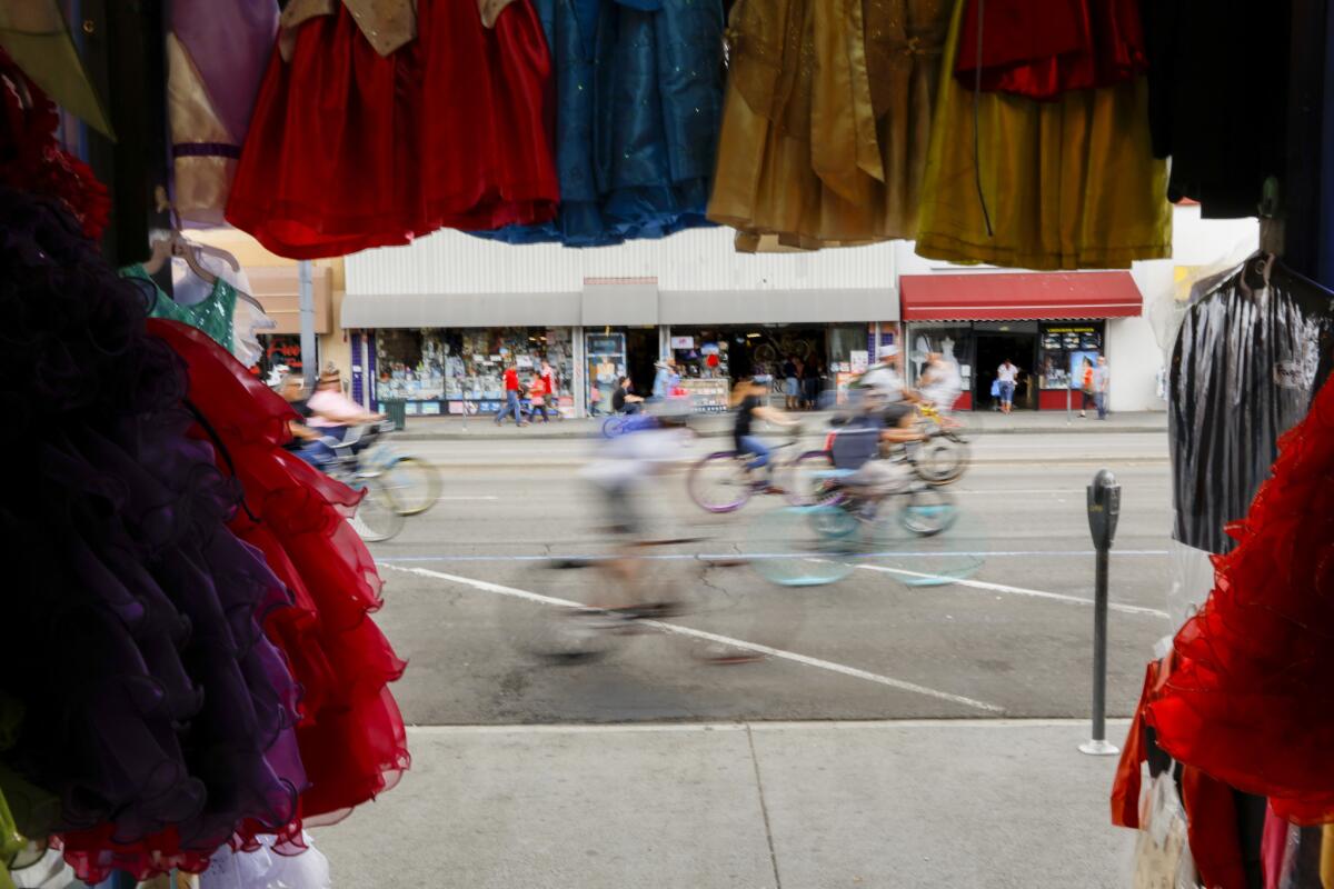 Bikes whiz along Pacific Boulevard in Huntington Park in May during the CicLAvia festival, which will be held again Sunday along Wilshire Boulevard.