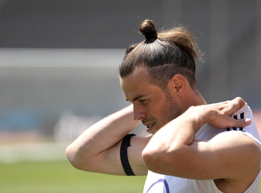 Wales' Gareth Bale gestures, during a practice session of the national soccer team of Wales, in Baku, Azerbaijan, Wednesday, June 9, 2021. The Euro 2020 gets underway on Friday June 11 and is being played in 11 host cities across 11 countries. The event was delayed by one year after being postponed in 2020 due to the COVID-19 pandemic. (AP Photo/Darko Vojinovic)