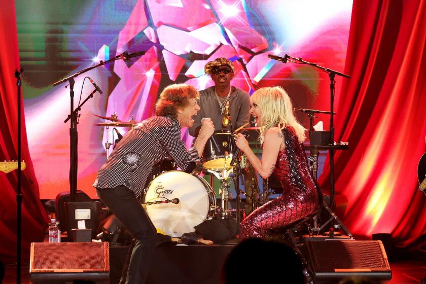 Mick Jagger and Lady Gaga perform during The Rolling Stones surprise set