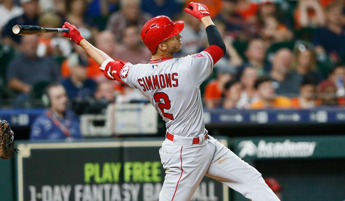 Angels shortstop Andrelton Simmons, hitting a home run against Houston in August, is a recipient of a Gold Glove for the fourth time.