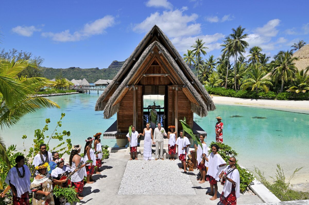 Traditional Chapel Ceremony in a overwater, glass-bottomed chapel at The InterContinental Bora Bora Resort & Thalasso Spa.