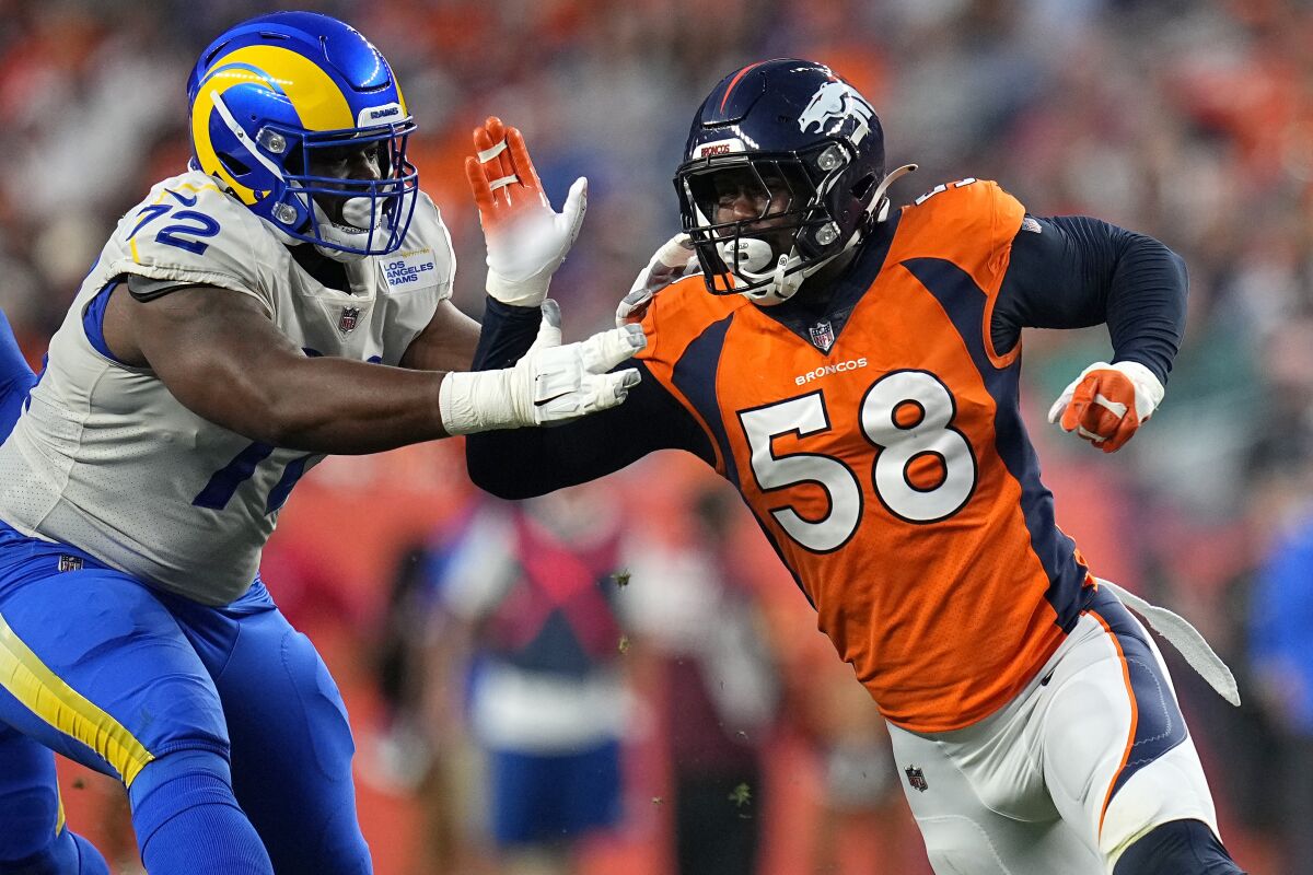 Von Miller (58), shown battling Rams guard Tremayne Anchrum (72) in an August exhibition, now plays for the Los Angeles club.
