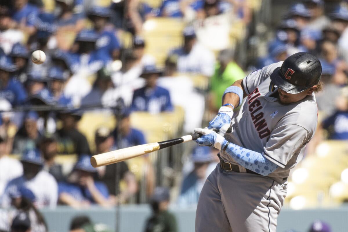 Cleveland's Josh Naylor hits a double during the ninth inning of the Dodgers' 5-3 loss Sunday at Dodger Stadium.
